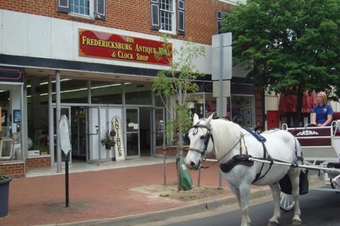 Fredericksburg Antique Mall & Clock Shop with horse and carriage out front
