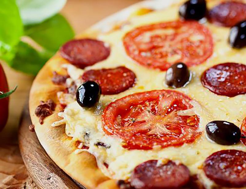 Pizza with tomato, olives and pepperoni from Primavera Pizzeria and Grill