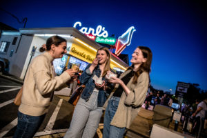 Girls eating ice cream outside of Carl's