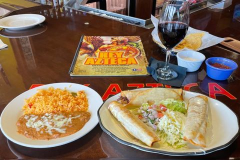 entrees and wine at Rey Azteca