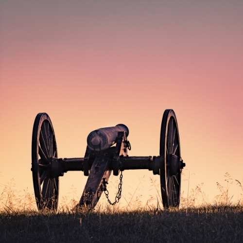 civil war cannon at sunset
