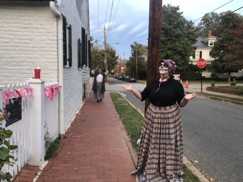 UMW student giving a ghost tour outside Mary Washington House