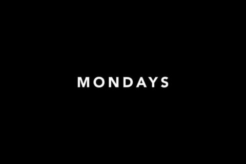 black screen with the word MONDAYS