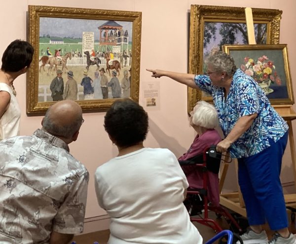 5 people looking at a gari melchers painting on the way