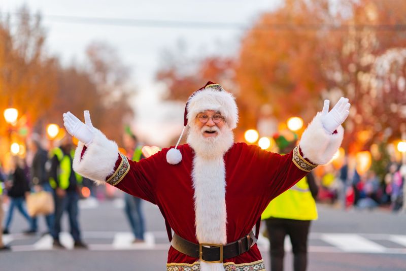 Santa smiling with arms wide open right before the Fredericksburg Christmas Parade