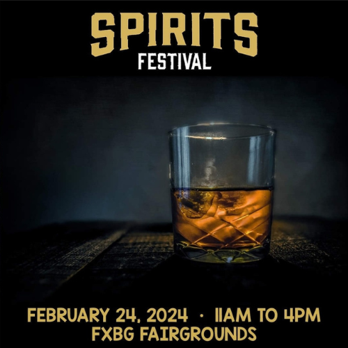 Spirits Festival February 24, 2024 11am to 4pm FXBG Fairground. Glass of whiskey with ice sitting on a wooden table