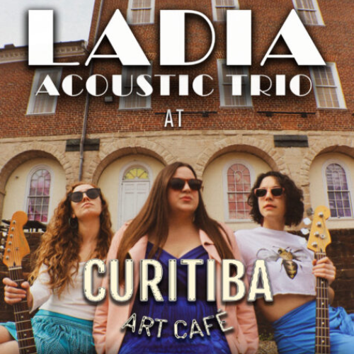Ladio Acoustic Trio at Curitiba Art Cafe. Three ladies wearing sunglasses and looking past the camera. the ladies on the right and left are holding guitars