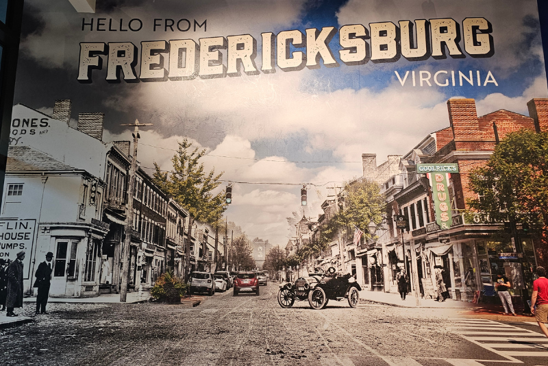 A blended picture of Caroline Street in Fredericksburg Virginia. Buildings from the left are of the 1920's and the right side is of 2024. 