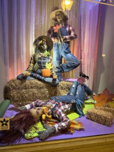 3 scarecrows in yoga positions.
