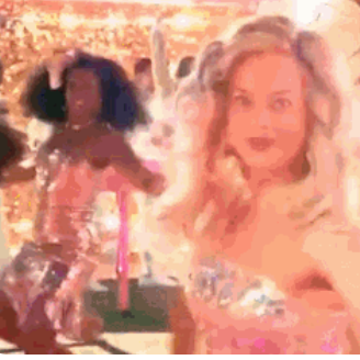 Two live-action barbies dancing.