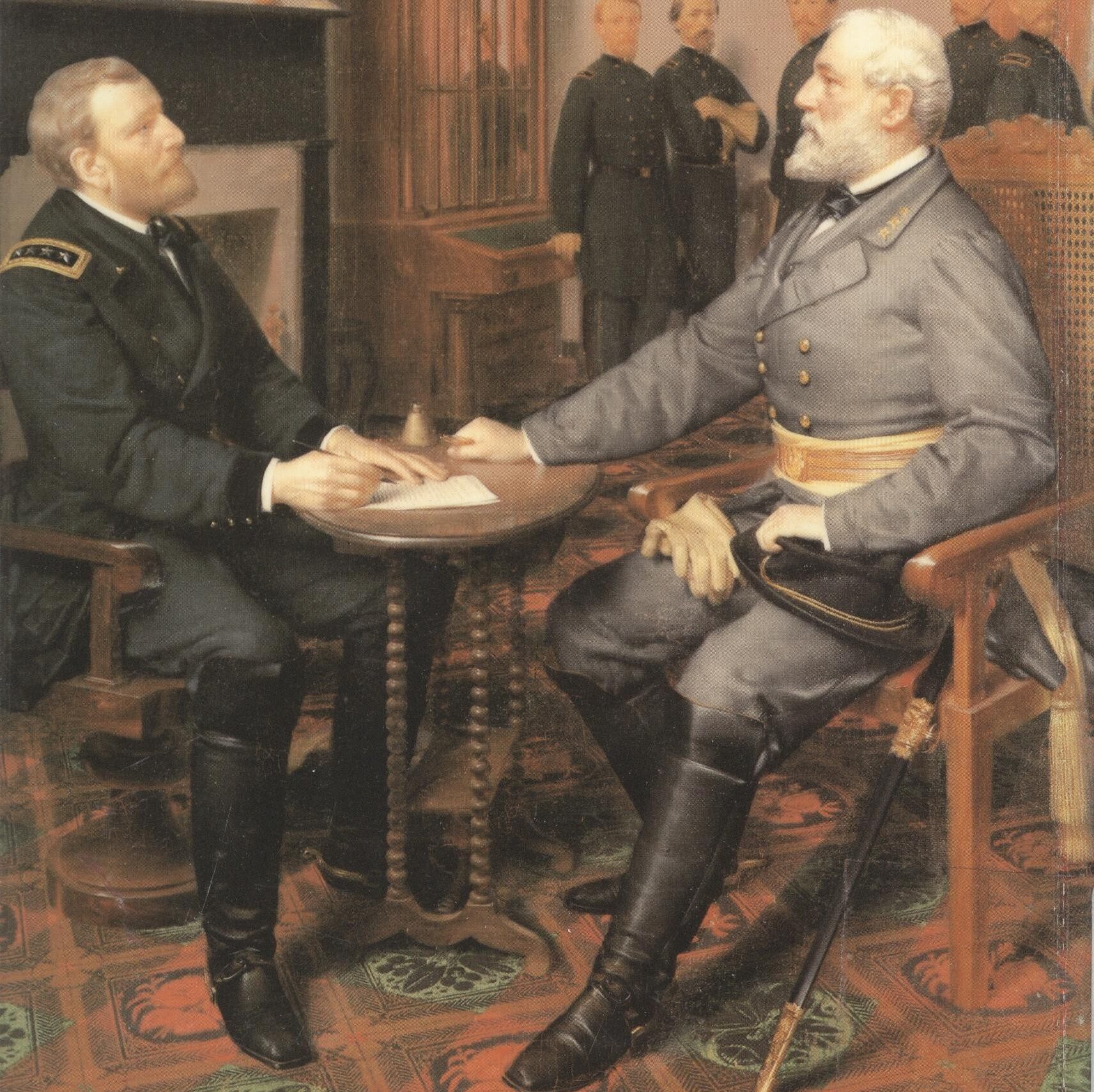 Two army generals sitting at a table looking at each other.
