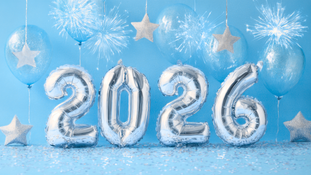 Blue background with silver stars and glitter and silver balloons spelling out "2026".