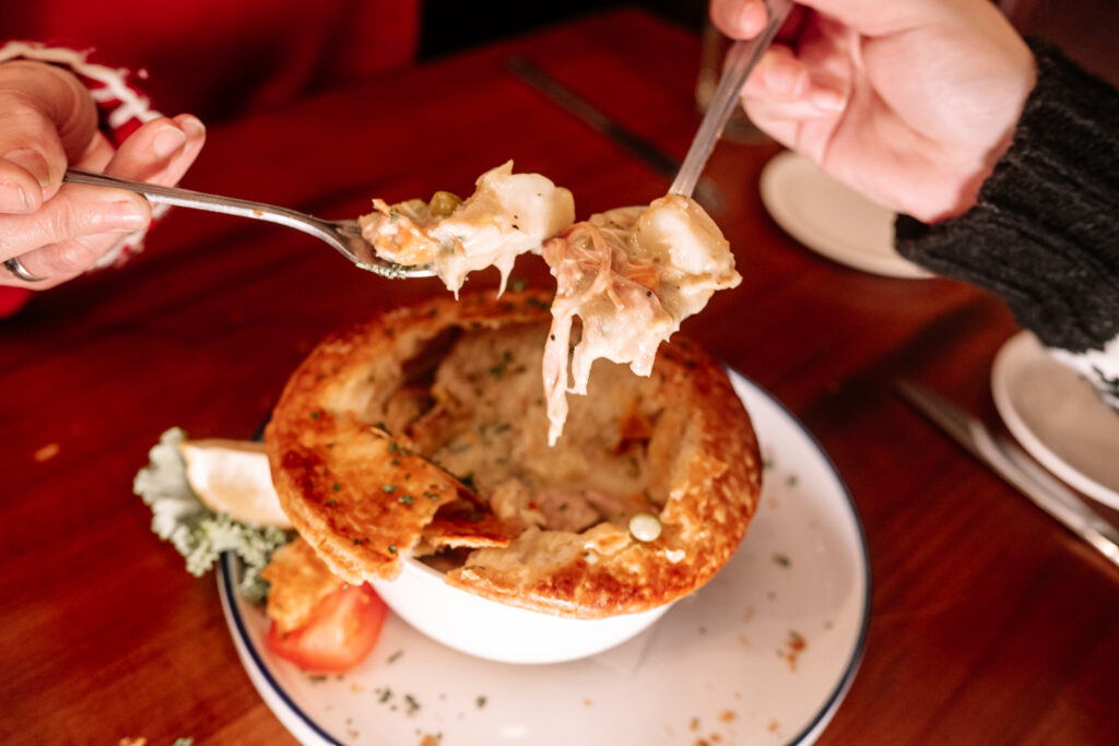 two forks eating our of a pot pie at the alpine chef.