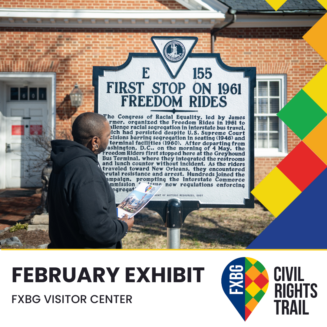 Man looking at the Freedom riders wayside panel.