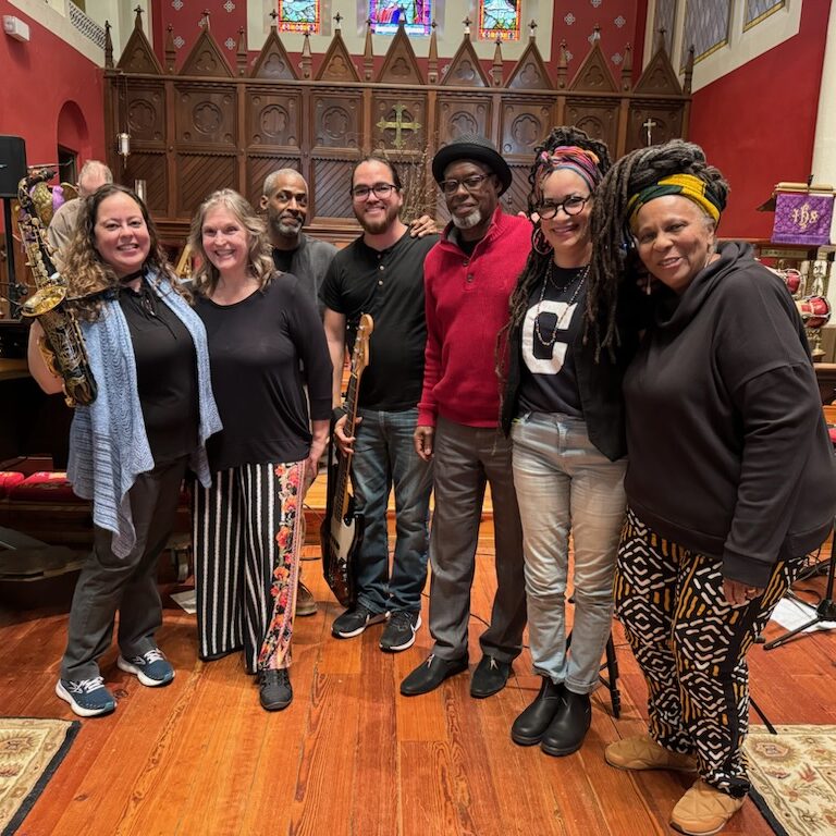 7 people posing together for a photo.