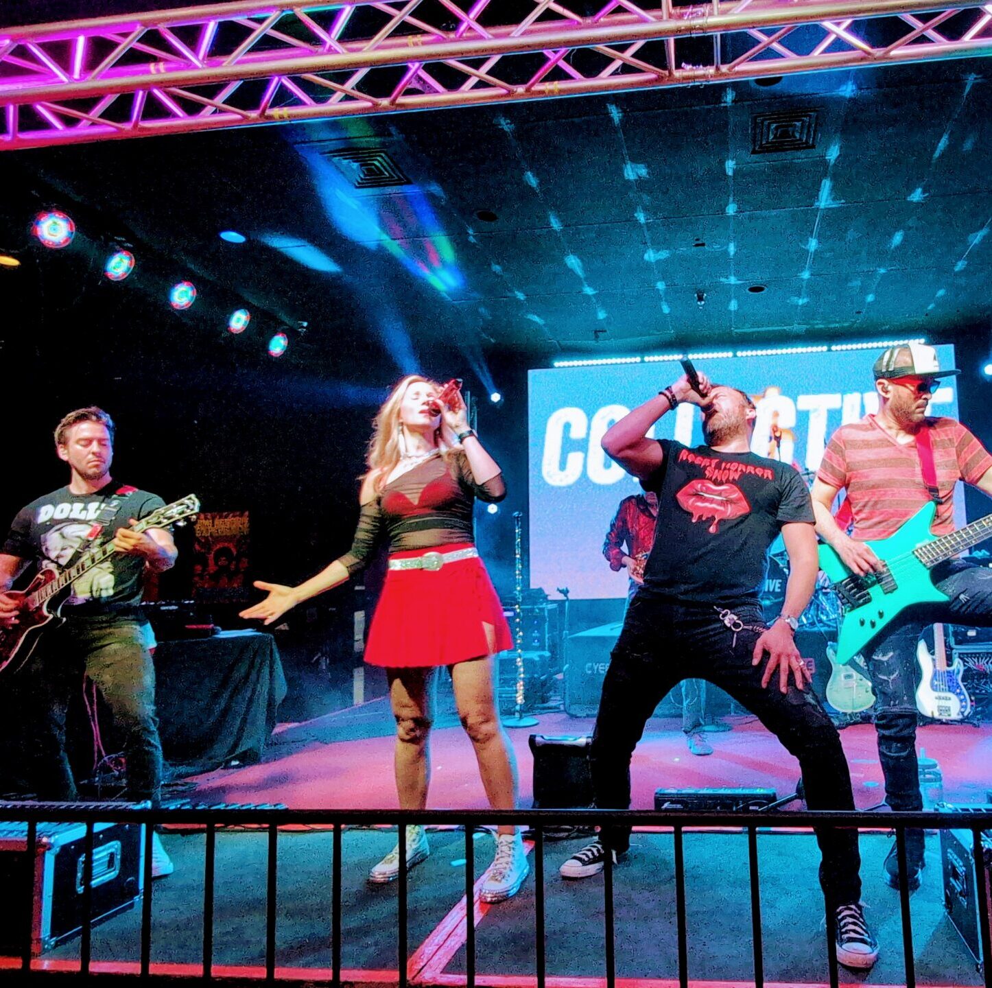 Collective band performing on stage.