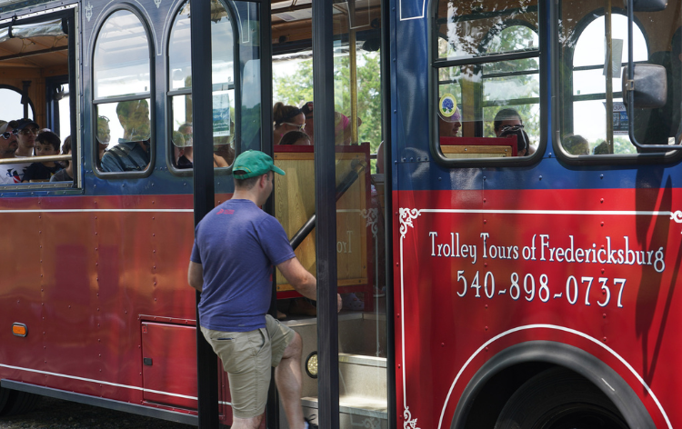 A man boarding the Fredericksburg Trolley