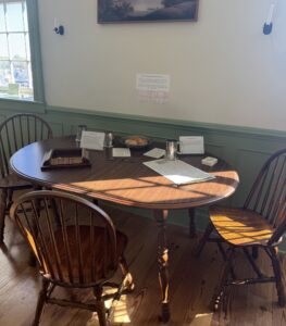 Wooden table set with colonial games at the Fredericksburg Area Museum.